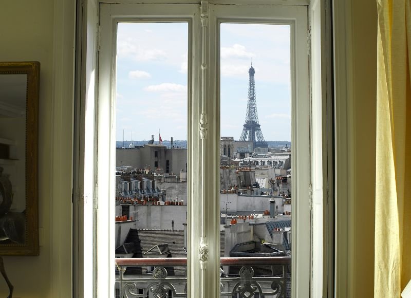 eiffel tower as seen through a flat in paris